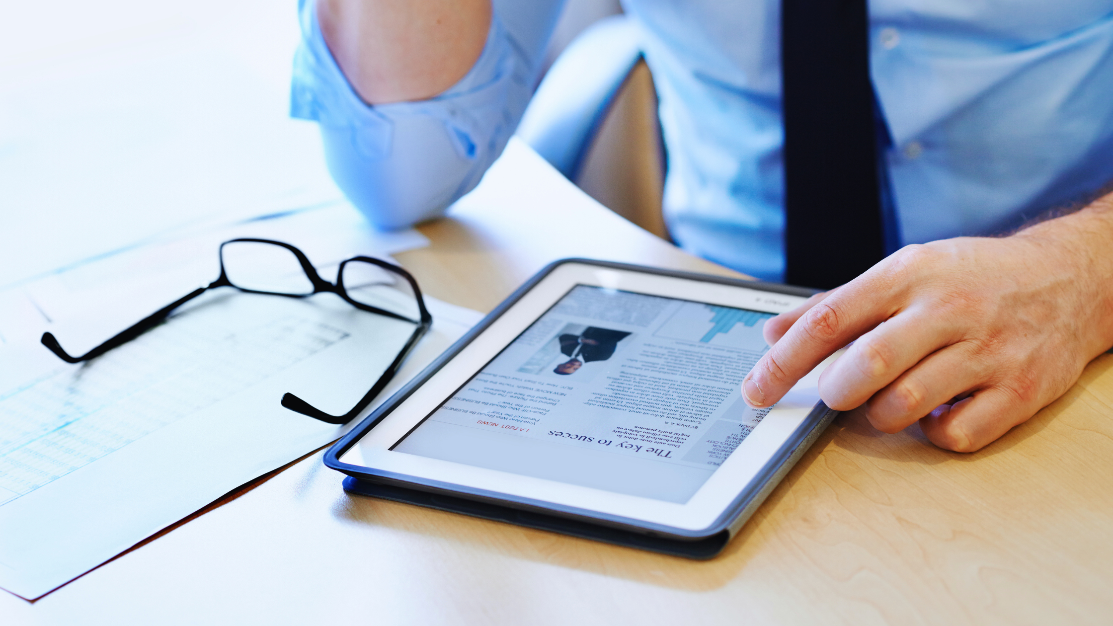 Man looking at his profile on a tablet
